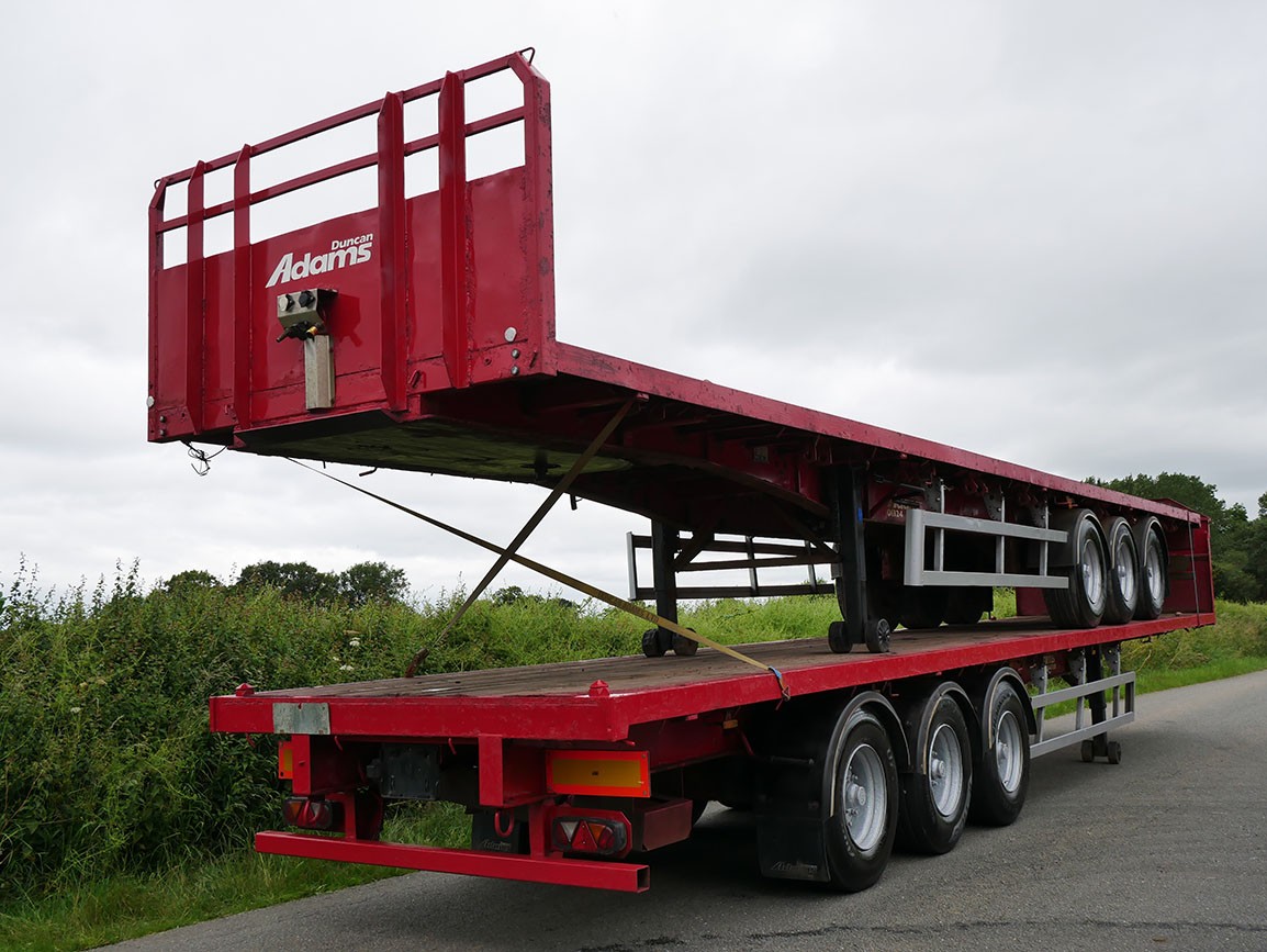 Stack of two PSK Tri Axle Flat Trailers 